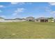 Expansive backyard showcasing a lush green lawn and ample space for activities, ideal for families at 7571 Sw 64Th Street Rd, Ocala, FL 34474