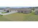 Backyard featuring a wide-open space, a privacy fence, and a sliding door for easy indoor-outdoor living at 7571 Sw 64Th Street Rd, Ocala, FL 34474