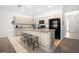 Well-appointed kitchen featuring granite countertops, stainless steel appliances, and a functional center island with seating at 7571 Sw 64Th Street Rd, Ocala, FL 34474