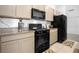 Modern kitchen featuring stainless steel appliances, stone countertops, and lots of storage space at 7571 Sw 64Th Street Rd, Ocala, FL 34474
