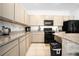 Modern kitchen featuring granite countertops, stainless steel appliances, and lots of storage space at 7571 Sw 64Th Street Rd, Ocala, FL 34474