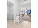Open-concept layout shows a comfortable living room leading to a laundry area with modern appliances at 7571 Sw 64Th Street Rd, Ocala, FL 34474