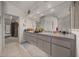 Bathroom featuring double sinks, tile floors and ample storage at 811 Se 49Th Ave, Ocala, FL 34471