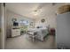Bedroom with natural light, a ceiling fan, a TV on a dresser, and floral decor accents at 811 Se 49Th Ave, Ocala, FL 34471