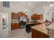 Open kitchen with stainless steel appliances, granite countertops and custom cabinets at 811 Se 49Th Ave, Ocala, FL 34471