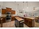 Open kitchen with stainless steel appliances, granite countertops and custom cabinets at 811 Se 49Th Ave, Ocala, FL 34471