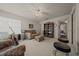 Inviting living space features plush carpeting, a ceiling fan, and a charming bookshelf at 811 Se 49Th Ave, Ocala, FL 34471