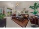 The spacious living room boasts vaulted ceilings, a chandelier, and plenty of natural light at 811 Se 49Th Ave, Ocala, FL 34471