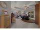 A relaxing primary bedroom is well-lit, with neutral decor, a ceiling fan, and a decorative rug at 811 Se 49Th Ave, Ocala, FL 34471