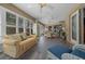Comfortable sunroom with lots of natural light and a view of the outdoors at 811 Se 49Th Ave, Ocala, FL 34471