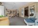 Spacious sunroom featuring multiple seating areas, natural light, and access to other rooms at 811 Se 49Th Ave, Ocala, FL 34471