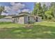 Exterior view of the home with a well-maintained lawn and landscaping at 838 Nw 124Th Street, Citra, FL 32113