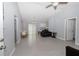 Spacious living room with light gray walls, tile floors, and a ceiling fan at 838 Nw 124Th Street, Citra, FL 32113