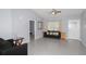 Open living room featuring tile floors, a ceiling fan, and light gray walls at 838 Nw 124Th Street, Citra, FL 32113