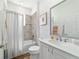 Bathroom featuring shower-tub combo, toilet, and vanity with a large mirror at 8693 Sw 76Th Ln, Ocala, FL 34481