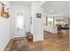 An open foyer with decorative wood floors, flowing into the kitchen and living room at 8693 Sw 76Th Ln, Ocala, FL 34481