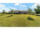 Well-maintained single story home with beautiful landscaping and expansive front yard at 8693 Sw 76Th Ln, Ocala, FL 34481