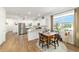Bright kitchen with white cabinets, stainless steel appliances, and granite countertops offers a modern design at 8693 Sw 76Th Ln, Ocala, FL 34481