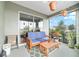 Comfortable screened lanai with patio furniture and views of the beautiful surrounding community at 8693 Sw 76Th Ln, Ocala, FL 34481