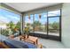 Relaxing screened lanai featuring comfortable seating and peaceful views of the outdoors at 8693 Sw 76Th Ln, Ocala, FL 34481