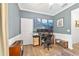 Home office featuring wainscotting, a large desk, and an accent rug at 8693 Sw 76Th Ln, Ocala, FL 34481
