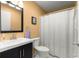 Well-maintained bathroom featuring a vanity sink, toilet, and shower with a curtain at 8747 Sw 98Th Street Rd # F, Ocala, FL 34481