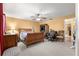 A bedroom featuring a ceiling fan, plenty of space, and natural light from the entrance at 8747 Sw 98Th Street Rd # F, Ocala, FL 34481