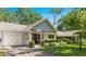 Charming home with a well-maintained front yard, covered porch, and a single-car garage at 8747 Sw 98Th Street Rd # F, Ocala, FL 34481
