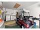 This garage features laundry machines, a golf cart and lots of space to move around at 8747 Sw 98Th Street Rd # F, Ocala, FL 34481
