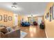 Bright living room boasts hardwood floors and comfortable furniture, creating a cozy space at 8747 Sw 98Th Street Rd # F, Ocala, FL 34481