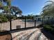 Gated community pool area with a beautiful brick-paved entrance and lush, mature landscaping, perfect for relaxation at 8951 Sw 202Nd Avenue Rd, Dunnellon, FL 34431