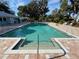 Relaxing community pool featuring clear turquoise water and tiled pool deck, perfect for hot days at 8951 Sw 202Nd Avenue Rd, Dunnellon, FL 34431