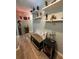 Inviting hallway decorated with unique shelving and decor creating a blend of style and comfort at 8951 Sw 202Nd Avenue Rd, Dunnellon, FL 34431