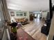 Spacious living room with wood-look flooring, comfortable seating, and an open layout for entertaining at 8951 Sw 202Nd Avenue Rd, Dunnellon, FL 34431