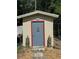 Outdoor shed featuring unique decor and a well-maintained exterior at 8951 Sw 202Nd Avenue Rd, Dunnellon, FL 34431