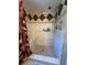 Modern tiled shower with built-in seat and decorative accents, offering a spa-like experience at 8951 Sw 202Nd Avenue Rd, Dunnellon, FL 34431