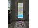 A view from inside, looking out at the screened-in pool area through a glass door at 8951 Sw 202Nd Avenue Rd, Dunnellon, FL 34431