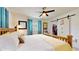 Bedroom with a wooden bed frame, soft white linens, and a closet with sliding barn doors, creating a relaxing space at 9050 Sw 101St Ln, Ocala, FL 34481