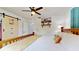 Bedroom featuring a wooden bed frame, a ceiling fan, and sliding closet doors for ample storage at 9050 Sw 101St Ln, Ocala, FL 34481