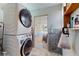Efficient laundry area with stacked washer and dryer, providing convenience and maximizing space at 9050 Sw 101St Ln, Ocala, FL 34481