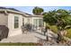 Cozy back patio with chairs, offering a relaxing outdoor space surrounded by well-maintained landscaping at 9452 Sw 93Rd Loop, Ocala, FL 34481