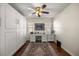 Neutral-toned bedroom features built-in storage, desk, and a stylish rug over wood flooring at 9452 Sw 93Rd Loop, Ocala, FL 34481