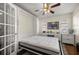 This bedroom with wood floors features a built-in bed and desk maximizing space and functionality at 9452 Sw 93Rd Loop, Ocala, FL 34481