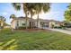 Charming single-story home with well-manicured lawn and tropical landscaping at 9452 Sw 93Rd Loop, Ocala, FL 34481
