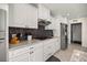 Well-appointed kitchen with ample white cabinetry, stainless steel appliances, and decorative backsplash at 9452 Sw 93Rd Loop, Ocala, FL 34481