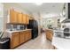 Kitchen with wood cabinets, black appliances, and tile flooring at 9773 Sw 90Th St, Ocala, FL 34481