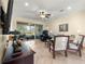 Bright and airy living room with tile flooring and comfortable seating arrangement at 9773 Sw 90Th St, Ocala, FL 34481