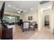 Open living space with tile flooring, ceiling fan, and sliding glass doors to the outside patio at 9773 Sw 90Th St, Ocala, FL 34481