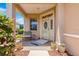 Cozy front porch with tiled flooring, outdoor seating, and decorative potted plants at 9773 Sw 90Th St, Ocala, FL 34481