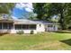Well-maintained backyard with lush green grass and an enclosed patio at 9855 Sw 85Th Terrace Rd # A, Ocala, FL 34481